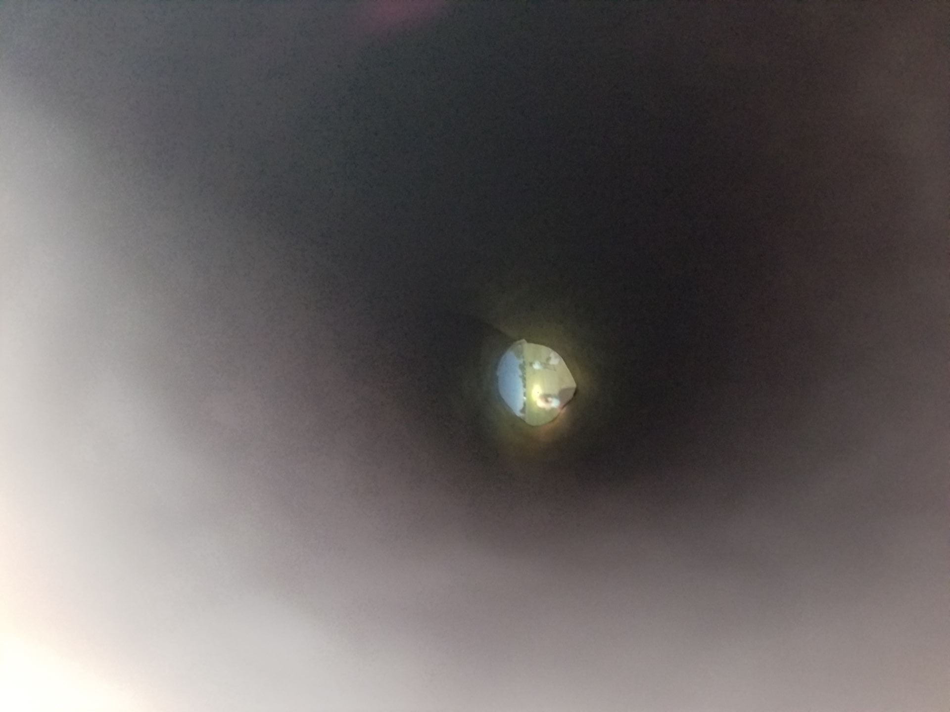 looking through the tube at the projected image